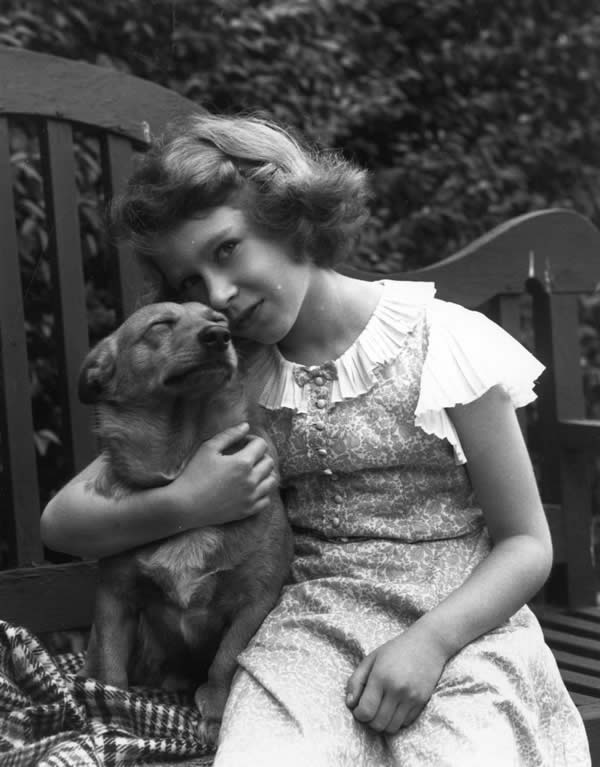 Queen Elizabeth when young with a dog