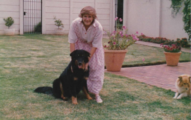 Dr Arielle in the 80's with family dog 