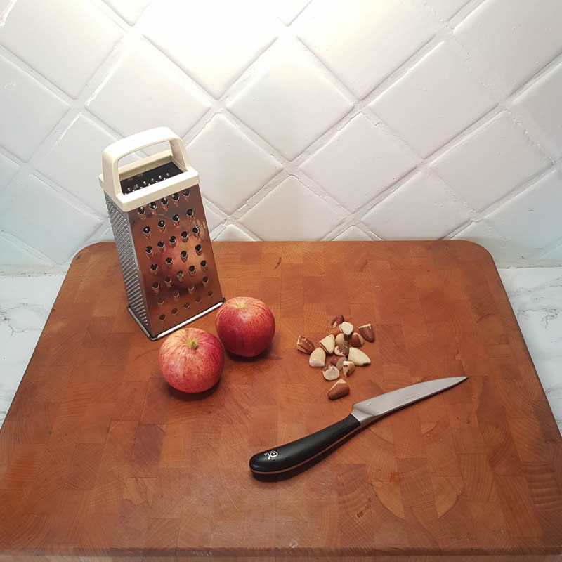 Grate, crush or roughly chop brazil nuts. Then add the apple and nuts to your paste and mix